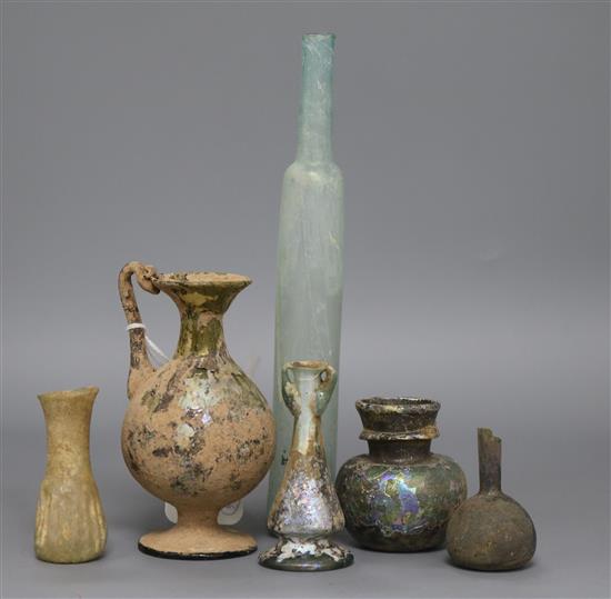 A group of Roman and ancient glass vessels tallest 12cm